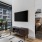 Convertible living room with frame TV and office nook
