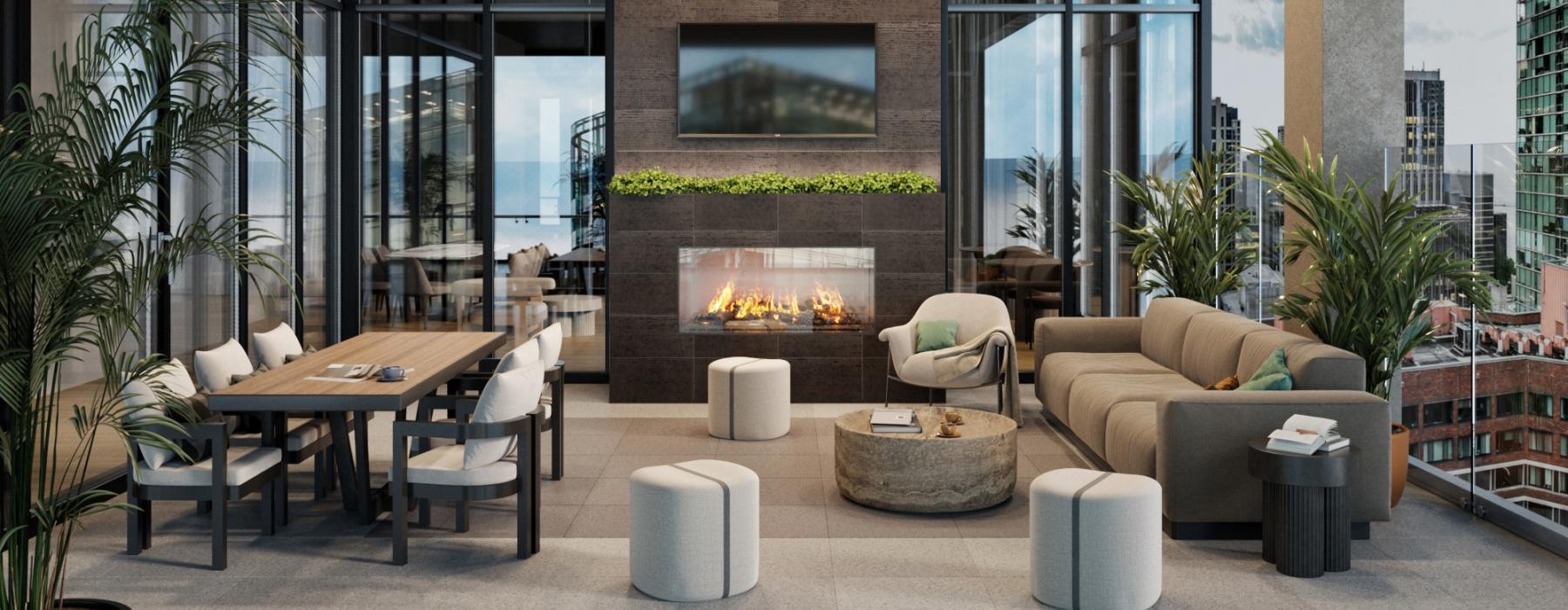 Covered balcony lounge with city views and large fireplace